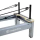 Reformer do pilatesu inSPORTline Oquiler ∙ system sprężynowy ∙ nośność 150 kg ∙ rama aluminiowa ∙ box w zestawie - Różowy